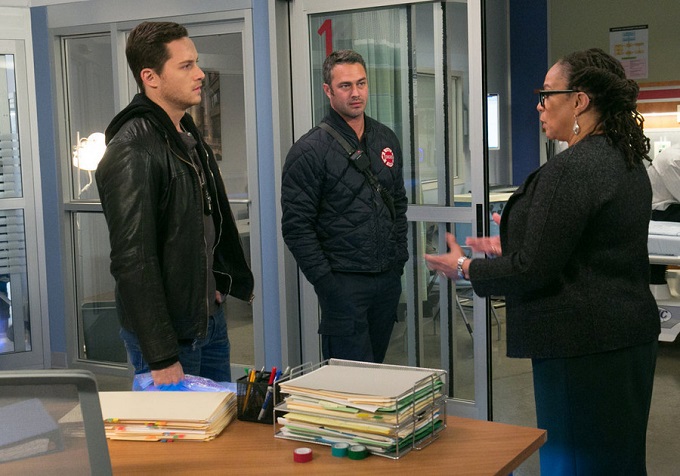 CHICAGO MED -- "Malignant" Episode 105 -- Pictured: (l-r) Jesse Lee Soffer as Jay Halstead, Taylor Kinney as Kelly Severide, S. Epatha Merkerson as Sharon Goodwin -- (Photo by: Elizabeth Sisson/NBC)