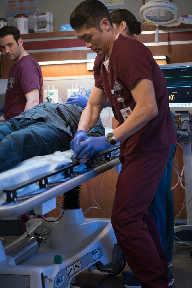 CHICAGO MED -- "Intervention" Episode 111 -- Pictured: (l-r) Colin Donnell as Dr. Connor Rhodes, Lorena Diaz as Nurse Doris, Brian Tee as Dr. Ethan Choi -- (Photo by: Elizabeth Sisson/NBC)
