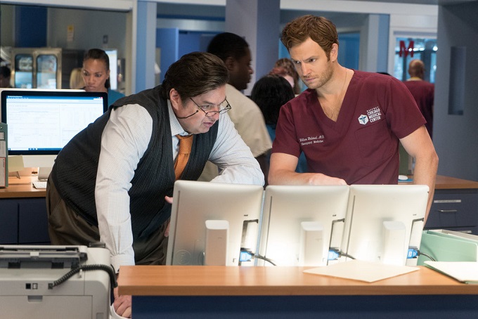 CHICAGO MED -- "Win Loss" Episode 203 -- Pictured: (l-r) Oliver Platt as Daniel Charles, Nick Gehlfuss as Will Halstead -- (Photo by: Elizabeth Sisson/NBC)