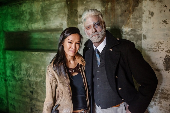 Z NATION -- "Everybody Dies In The End" Episode 315 -- Pictured: (l-r) Sydney Viengluang as Sun Mei, Keith Allan as Murphy -- (Photo by: Frank Schaefer/Go2 Z/Syfy)